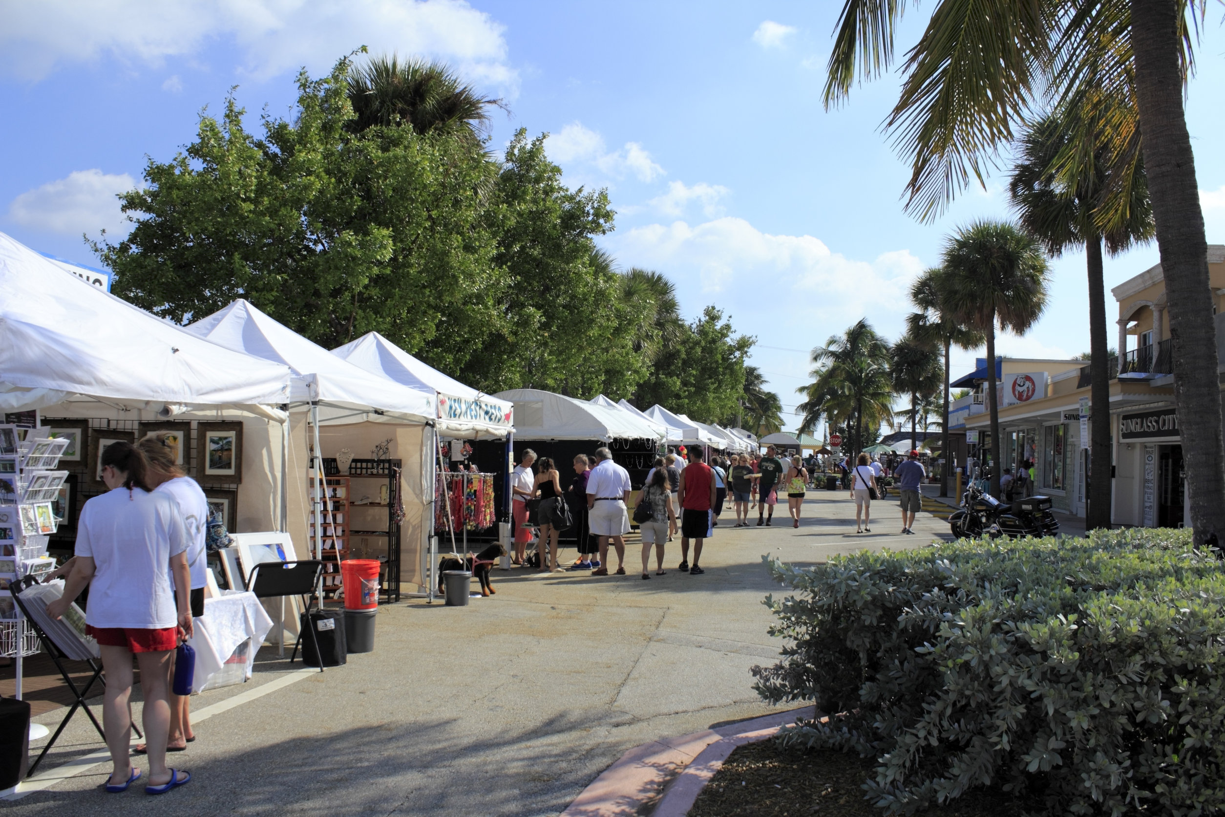LAUDERDALE-BY-THE-SEA, FLORIDA - OCTOBER 28, 2012: People shopping early at the annual craft festival where local crafters display at outdoor galleries in Lauderdale-by-the-Sea, Florida.